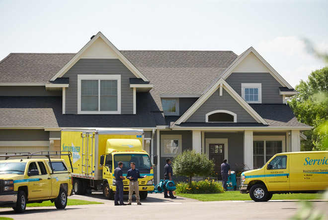 ServiceMaster team outside a home